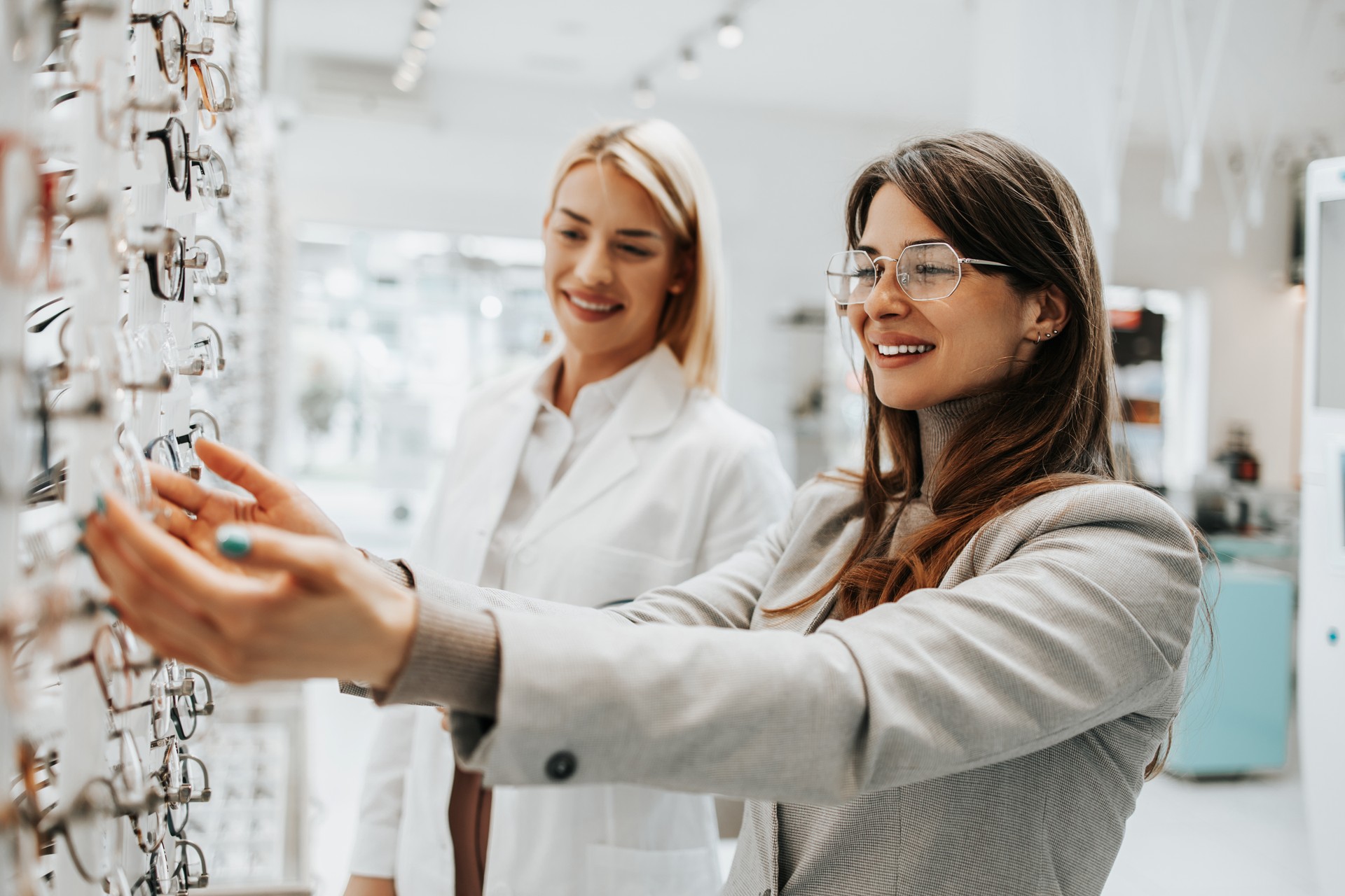 Young adult woman buying eyeglasses